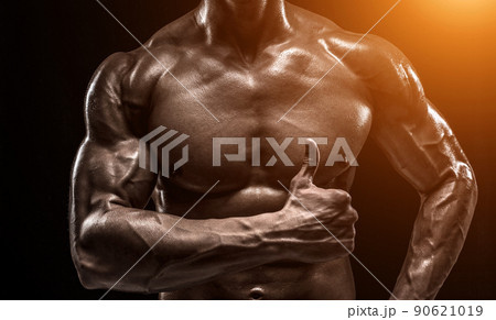 Part of a man's body on a dark background with copyspace 90621019
