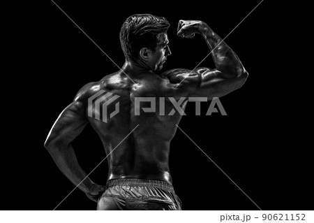Strong Athletic Man Fitness Model posing back muscles, triceps o 90621152