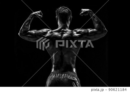 Strong Athletic Man Fitness Model posing back muscles, triceps o Strong Athletic Man Fitness Model posing back muscles, triceps o 90621184