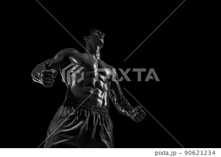 Muscular and fit young bodybuilder fitness male model posing ove Muscular and fit young bodybuilder fitness male model posing ove 90621234