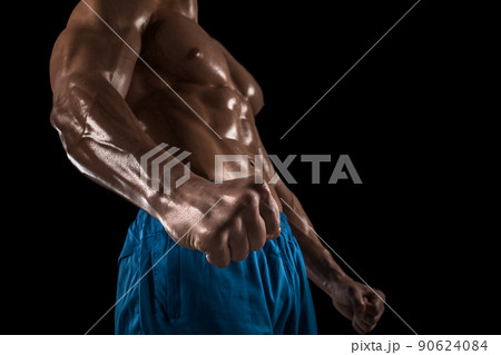 Part of a man's body on a dark background with copyspace Part of a man's body on a dark background with copyspace 90624084