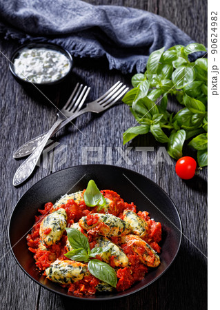 Malfatti, hot Italian spinach ricotta dumplings 90624982