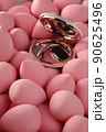 beauty background a bunch of pink gentle makeup sponges and a mirror vertical orientation 90625496