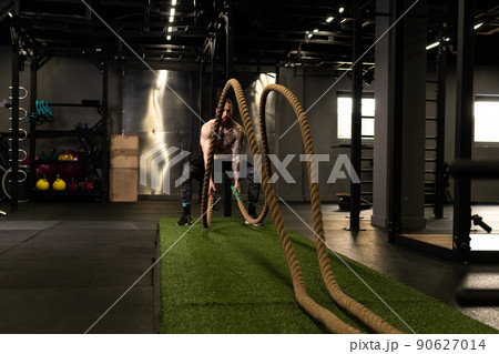 Rope man fitness gym beard training battle fit sport exercise, concept active equipment from physical from athletic activity, caucasian energy. Sportswoman people bodybuilding, Rope man fitness gym beard training battle fit sport exercise, concept active equipment from physical from athletic activity, caucasian energy. Sportswoman people bodybuilding, 90627014