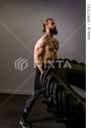 Fitness gym tire muscular wheel male strong man ABS training, concept exercise fit from power from young dedication, effort healthy. Barbell active arm, Fitness gym tire muscular wheel male strong man ABS training, concept exercise fit from power from young dedication, effort healthy. Barbell active arm, 90627015