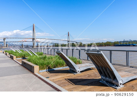 Westminster Pier Park. SkyBridge spans the Fraser River and connects New Westminster with Surrey. British Columbia, Canada. 90629150