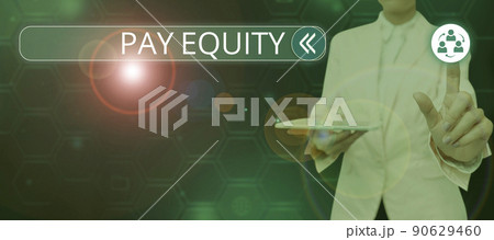 Hand writing sign Pay Equity. Business concept eliminating sex and race discrimination in wage systems Lady in suit holding pen symbolizing successful teamwork accomplishments. 90629460
