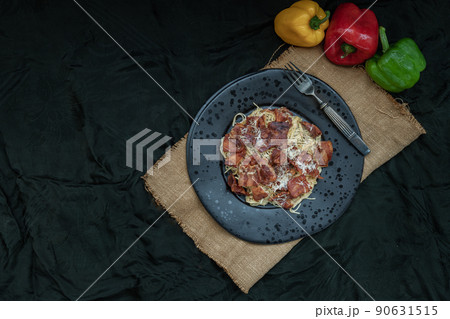 Truffle carbonara spaghetti with fried bacon and grated cheese in ceramic plate. 90631515