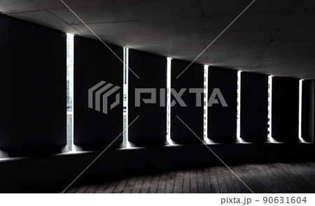 Light channels from cement wall of Curving shaped ramp on high building. 90631604