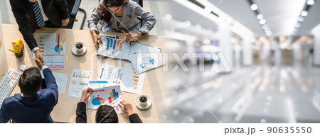 Group business people handshake at meeting table in widen view 90635550