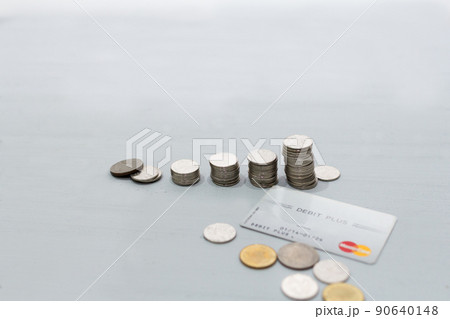 Coin money stack and credit card with space for text background. Saving and financial security concept. Coin money stack and credit card with space for text background. Saving and financial security concept. 90640148