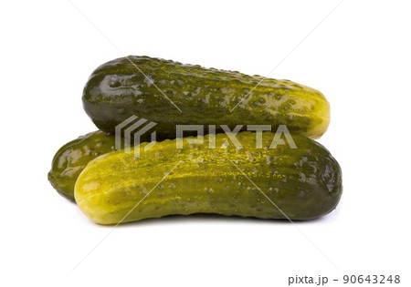 Marinated pickled cucumber isolated on white background. Pickled cucumber with clipping path. Closeup. Marinated pickled cucumber isolated on white background. Pickled cucumber with clipping path. Closeup. 90643248