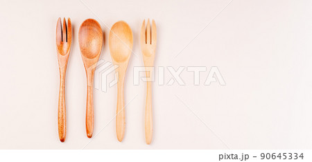 Set of eco friendly bamboo eating ,wooden cutlery.Zero waste traveling set.Wooden cutlery for reusable use.Environmental protection concept.made of natural materials.Plastic free.Sustainable lifestyle Set of eco friendly bamboo eating ,wooden cutlery.Zero waste traveling set.Wooden cutlery for reusable use.Environmental protection concept.made of natural materials.Plastic free.Sustainable lifestyle 90645334