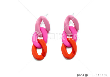 plastic earrings on a white insulated background plastic earrings on a white insulated background 90646360