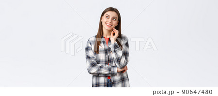 Lifestyle, different emotions, leisure activities concept. Dreamy young pretty girl imagine her summer vacation, look upper left corner with pleased smile, picturing travelling abroad, thinking 90647480