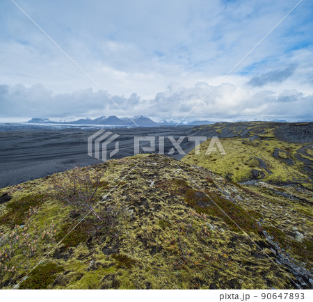 Iceland autumn tundra landscape near Haoldukvisl glacier, Iceland. Glacier tongue slides from the Vatnajokull icecap or Vatna Glacier near subglacial Esjufjoll volcano. Not far from Iceland Ring Road. 90647893