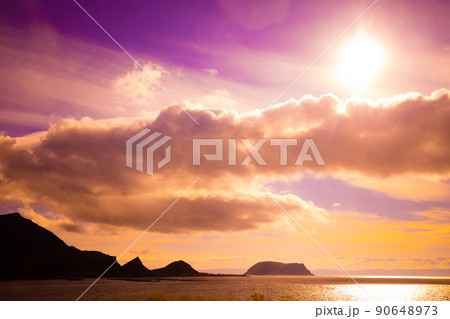 Beautiful purple seascape with dramatic cloudy sky at sunset. Wild nature Norway. Islands on the horizon. Nordkapp, Mageroya island Beautiful purple seascape with dramatic cloudy sky at sunset. Wild nature Norway. Islands on the horizon. Nordkapp, Mageroya island 90648973
