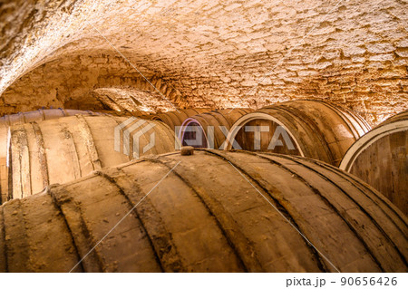 Vintage winery cellar with wine wooden barrels 90656426