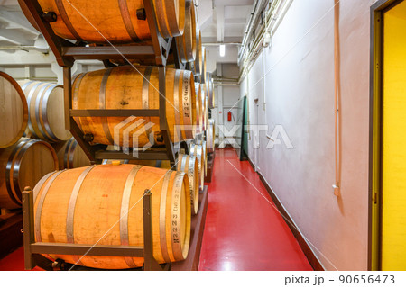 Vintage winery cellar with wine wooden barrels 90656473