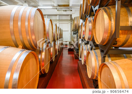 Vintage winery cellar with wine wooden barrels 90656474