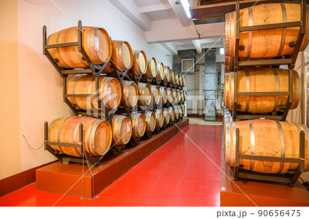 Vintage winery cellar with wine wooden barrels 90656475