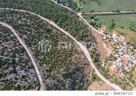 Meandering serpentine road in the mountain. Aerial view. Copter, drone view Meandering serpentine road in the mountain. Aerial view. Copter, drone view 90656712