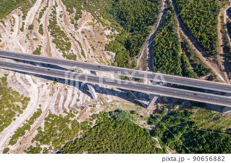 Aerial view on highway bridge in the mountain. Drone, copter view. 90656882
