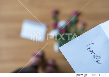 woman with paper letter and word goodbye on a floor. Heart broken concept. Copy Space woman with paper letter and word goodbye on a floor. Heart broken concept. Copy Space 90661902
