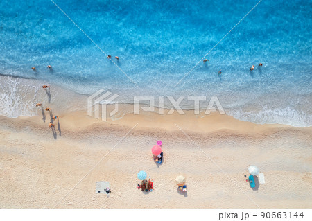 Aerial view of adriatic sea, waves, sandy beach and umbrellas 90663144