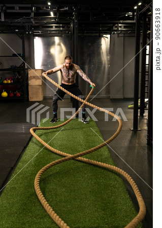 Rope warehouse fitness green man grass training gym muscular young, for strong strength from physical from healthy activity, person muscle. Cross ground holding, 90663918