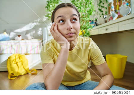 Teenage female student having video call, looking at webcam Teenage female student having video call, looking at webcam 90665034