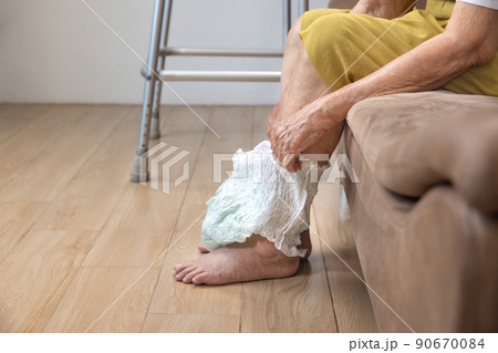 Urinary Incontinence in elderly and changing diaper. Urinary Incontinence in elderly and changing diaper. 90670084