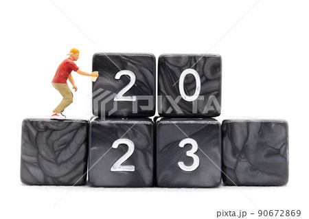 Miniature People Graffiti Artist spraying Number 2023 On Block 90672869