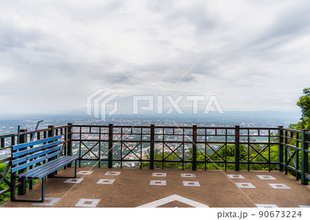 view City from the viewpoint on the road to Doi Suthep of the mountain cityscape over the city building hotel, shopping mall,temple and houses air atmosphere rain fog sky abstract with white clouds. 90673224