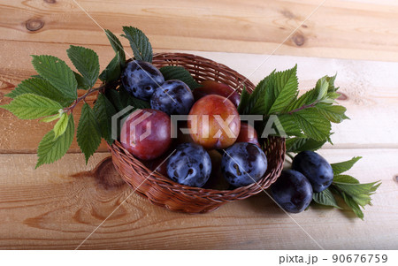 Plums on table 90676759