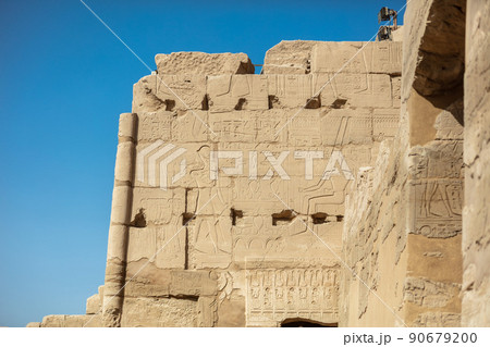 Different hieroglyphs on the walls and columns in the Karnak temple. Karnak temple is the largest complex in ancient Egypt. 90679200