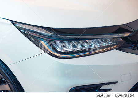 Closeup detail of headlight of auto car. 90679354