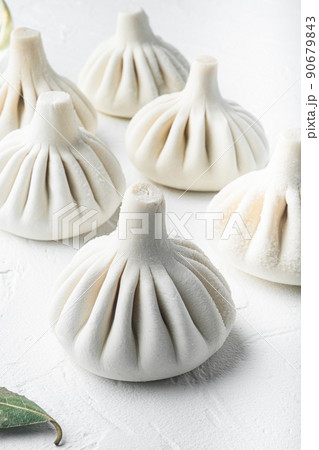 Manti, Turkish traditional ravioli, on white stone surface Manti, Turkish traditional ravioli, on white stone surface 90679843