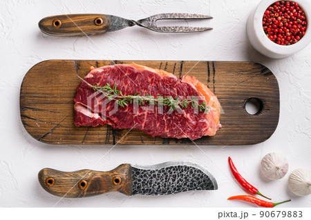 Meat steak, on white stone table background, top view flat lay Meat steak, on white stone table background, top view flat lay 90679883