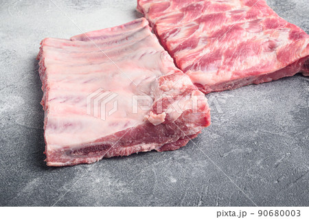 Pork rib, on gray stone background Pork rib, on gray stone background 90680003