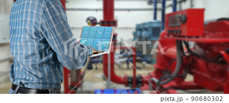 industrial engineer in Using a laptop of Machine inspection is in progress. 90680302