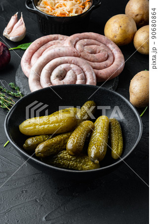 Fermented vegetables Pickled gherkins cucumbers, on black background 90680864