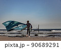 wing foil old kiter on the beach 90689291