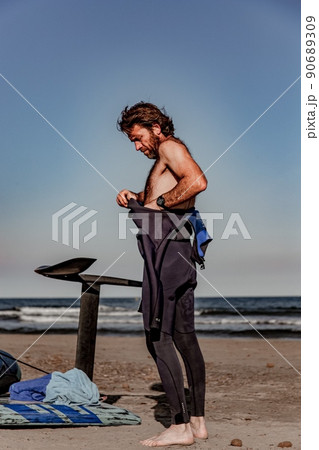 wing foil old kiter on the beach 90689309