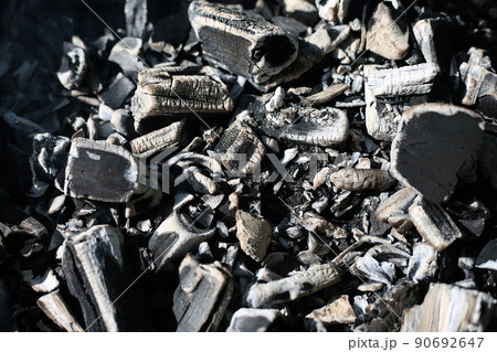 Charcoal is smoldering in the grill for cooking. Ashes, heat, smoke and fire of coals. Burning background Charcoal is smoldering in the grill for cooking. Ashes, heat, smoke and fire of coals. Burning background 90692647