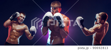 Two boxers boxing on dark background with copy space. Sport concept Two boxers boxing on dark background with copy space. Sport concept 90692813
