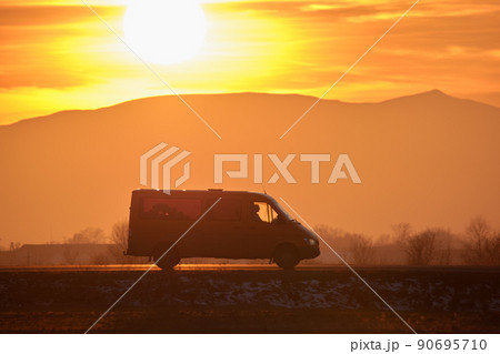Small cargo van driving on highway hauling goods. Delivery transportation and logistics concept 90695710
