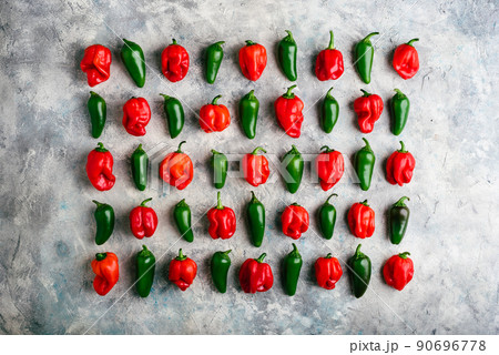 Jalapeno and Habanero Peppers on Concrete Surface Jalapeno and Habanero Peppers on Concrete Surface 90696778