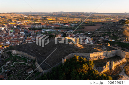 Drone view of ruined Mocha tower on hilltop with fortified walls in Calatayud 90699054