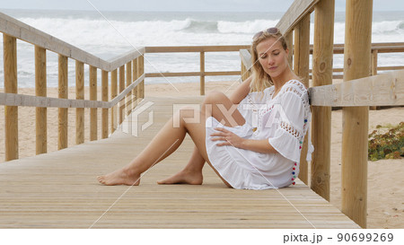 Sexy girl poses for the camera - happy girl on summer vacation at the beach 90699269